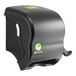 A black San Jamar paper towel dispenser on a counter.