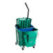 A Carlisle green mop bucket with a handle and side press wringer.