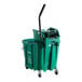 A green Carlisle OmniFit mop bucket with black handles and wheels.