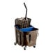 A Carlisle brown and blue mop bucket with a side press wringer and soiled water insert.