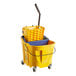 A yellow Carlisle OmniFit mop bucket with a blue wringer and handle.