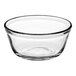 An Anchor Hocking clear glass mixing bowl with a rim.