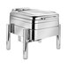 A silver Eastern Tabletop Jazz Rock chafer with a glass lid on a stand with legs.