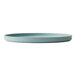 A Oneida Moira blue stoneware plate with a white rim.