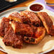 A plate of ribs with sauce and a glass of beer seasoned with Morton Season-All.