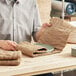 A man holding a plate of ecoMAX Care cellulose wadding.