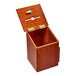 An oak wood wall mounted suggestion box with a metal lid open.