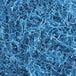A pile of Spring-Fill Sky Blue Crinkle Cut paper shred.