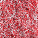 A pile of Spring-Fill red and white crinkle cut paper shred.