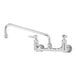 A chrome T&S wall-mounted pantry faucet with lever handles.