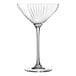 A clear Chef & Sommelier coupe glass with a curved stem.