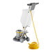 A Lavex Pro floor cleaning machine with a yellow hose.