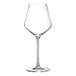 A close-up of a clear Chef & Sommelier wine glass with a long stem.