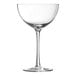 A clear wine glass with a stem.