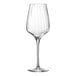 A close-up of a clear Chef & Sommelier wine glass with a long stem.