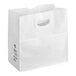 A white Duro paper bag with die cut handles.