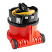 A NaceCare Solutions ProSave canister vacuum with a hose attached and a battery-powered brush.