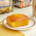 A close-up of Ne-Mo's Bakery Zesty Lemon Cake Bread on a plate.