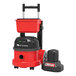 A red and black NaceCare Latitude cordless canister vacuum with a black plastic container and lid.