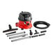 A red and black NaceCare Solutions Henry ProVac canister vacuum with hard floor accessories.