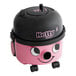 A pink and black NaceCare Solutions Hetty 200 canister vacuum.