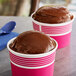 Two cups of brown Philadelphia Water Ice Root Beer Italian Ice.