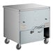 A True undercounter refrigerator with wheels and a door.