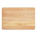 A wooden cutting board with rounded edges on a white background.