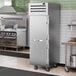 A stainless steel True Spec Series reach-in freezer with a white door and a handle.