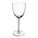 A close-up of a clear Della Luce Nick and Nora glass with a long stem.