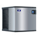 A silver and black Manitowoc water cooled ice machine with blue and black trim.