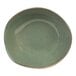 A moss green bowl with a white border.