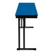 A Persian blue National Public Seating folding table with black legs.