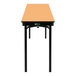 A National Public Seating rectangular folding table with a light brown top and black edge.