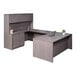 A Boss driftwood laminate desk with lateral storage and a cabinet.