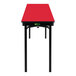 A red rectangular National Public Seating table with black T-mold edge and legs.