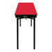 A red rectangular National Public Seating table with a black edge and legs.