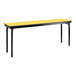 A long rectangular marigold and black National Public Seating plywood folding table with T-mold edge.