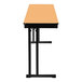 A rectangular National Public Seating Fusion Maple plywood folding table with black cantilever legs and a T-mold edge.