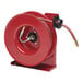 A red Reelcraft hose reel with a black hose attached.
