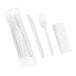 A white heavy weight plastic fork and knife set wrapped in a white napkin.