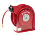 A red Reelcraft hose reel with a hose attached.