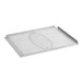 A stainless steel metal grate with holes.