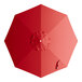 A red umbrella canopy for a round table with a hole in the top.