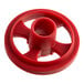 A red plastic wheel with a hole in the center.