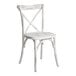 A white wooden Lancaster Table & Seating outdoor chair with a cross back.