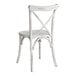 A white wooden Lancaster Table & Seating outdoor chair with a cross back.