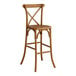 A Lancaster Table & Seating Vineyard Series Barrel Brown Wood Outdoor Cross Back Bar Stool with a backrest.