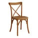 A Lancaster Table & Seating Vineyard Series Barrel Brown Outdoor Cross Back Chair. A wooden chair with a cross back.