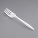 A close-up of a Remcoda white plastic fork.